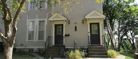 Sister Victorian mansion. One door leads to Parlor, other leads Entry & library