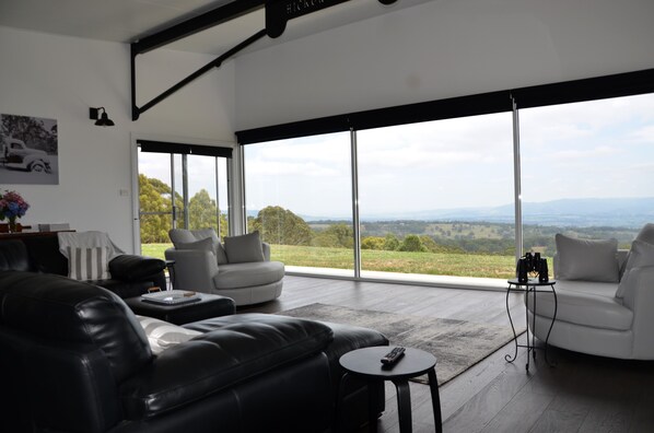 The living area has two huge leather snuggle chairs.  Pass the binoculars...