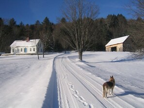 the farm house after an early snowfall