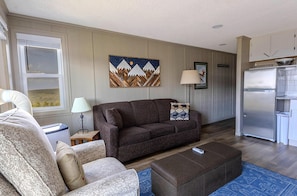The sleeper sofa in the living room accommodates two people.