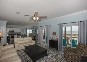 Open den to kitchen and dining area. Beautiful view of the beach and gulf.