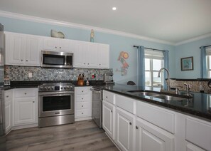 Range, micro, DW and fridge. Range has an Air Fryer.