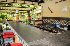 OverSized Pool Bar with Lots of Space to Make Margaritas - and we have the BBQ