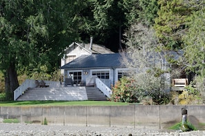 In the background is an upper bedroom that is blocked off due to unsafe  stairs.