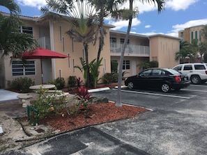 Front of building, picnic table and parking