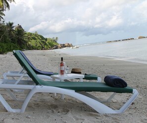 Enjoy one of Seychelles' best beaches on one of our 12 sun loungers
