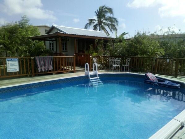 A view of the Pool House from the other side of the pool.