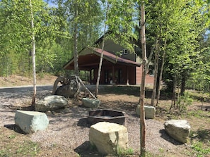 Bonfire pit with rock seating area.