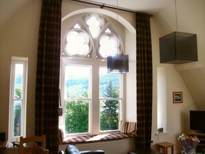 The living room with the Gothic windows looking down Loch Ness