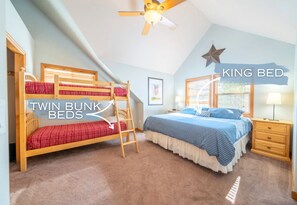 The First Upstairs Bedroom Features a King Bed and Twin-Over-Twin Bunks