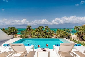 Sandpebble's private pool with direct access to Grace Bay Beach. 