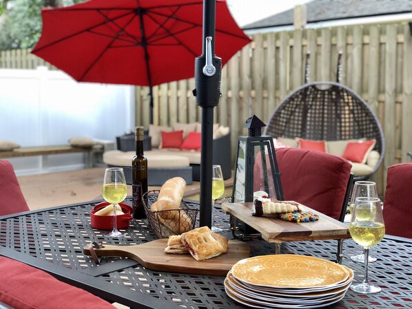 Outdoor dining patio with solar LED lit umbrella