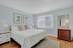 The primary bedroom features a king bed.