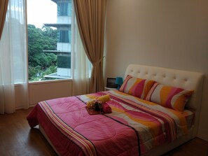 Master bedroom with a comfortable queen size bed with pillow, comforter bedsheet