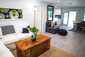 Living / dining room french doors lead right out to lanai and caged-in pool