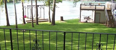 View of waterfront from Master Bedroom deck with table and chairs