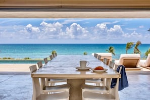Built in concrete dining table with seating for 12 & water views to die for!