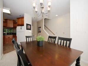Ocean Breeze 100 - Dining Area - The dining area is towards the front entrance of the villa with stairs leading to the second floor.