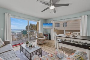 Living and dining Room View - Extra balcony space with the Gulf front patio wrapping around the building to provide more views.