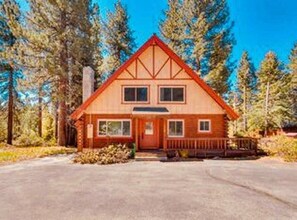 Front of house with flat, easy parking for a small boat, RV or trailer