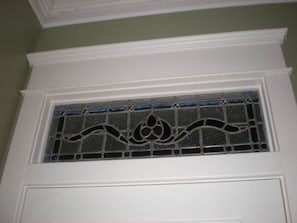 Stained glass is just part of the character found in this historic 1925 home!!