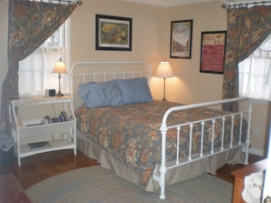 The main bedroom houses a comfy pillow top queen mattress and luxurious linens.