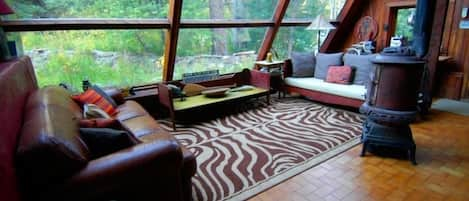 Living room looking out into forest...