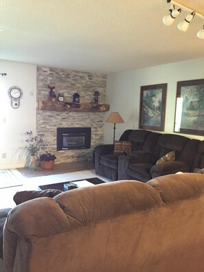 Living room and fireplace viewed from dining room.