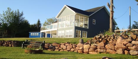 Beach side of house with fire pit