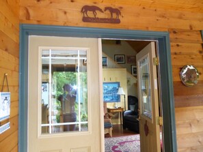 Front door of the main cabin, entering into the open concept lower level.