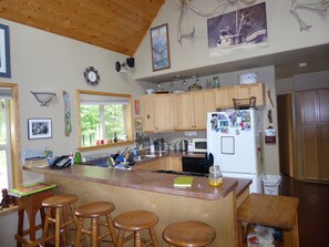 Kitchen with new loft over top.