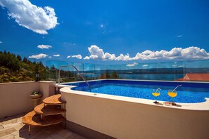 Heated pool is fenced with glass so you can enjoy in amazing view.