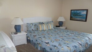 Bedroom with a beautiful view of inter coastal waterway, and boats going by. 