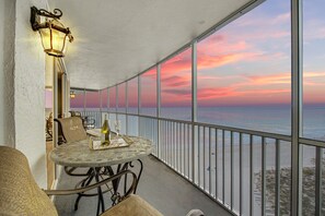 Watch the sunset with a glass of wine from the condo private lanai