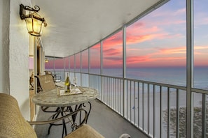 Watch the sunset with a glass of wine from the condo private lanai