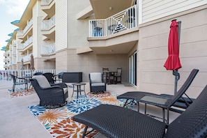 Large patio with steps to grounds.