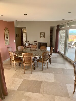 Dining room opening to the pool and view