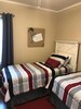 Two twin beds in 2nd bedroom