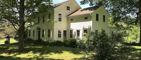 1840 Center Hall with 1810 Eyebrow original house with maple tree lined semi-circle driveway.