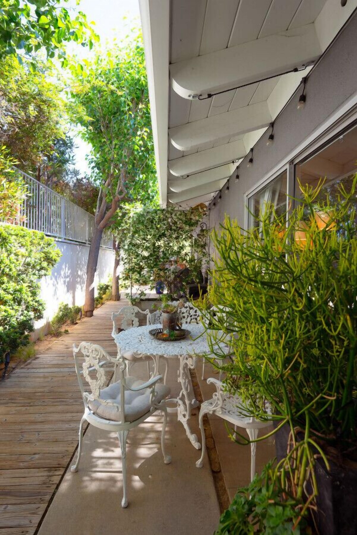Newly remodeled, uniquely styled property surrounded by botanical-like garden setting.