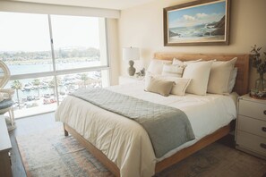 Master bedroom with King bed looking over Glorietta bay. 