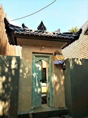 Angkul-angkul is balinese main entrance to the house with decorative door & roof