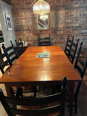 Dining room table next to kitchen