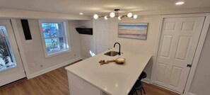 Eat in kitchen (table & chairs now in place) island storage & extra seating.