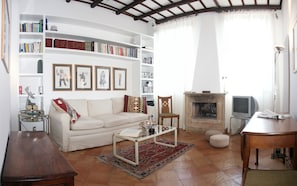 The marble-floored entry hall leads to the gracious living-dining room