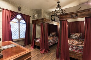 Kids will love this custom bedroom with two twin four poster beds