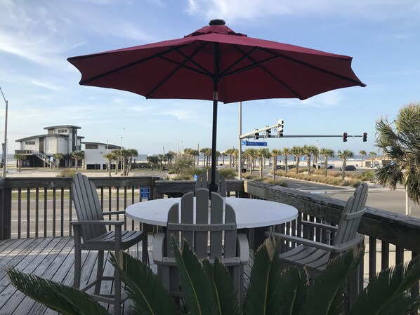 Front balcony with beautiful views of the beach.  Crosswalk at light to beach.