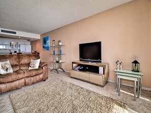 Large flat screen TV in living room.