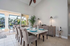 Formal Dining Space with Views of the Pool and Lanai