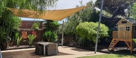 Shaded outdoor entertainment area.